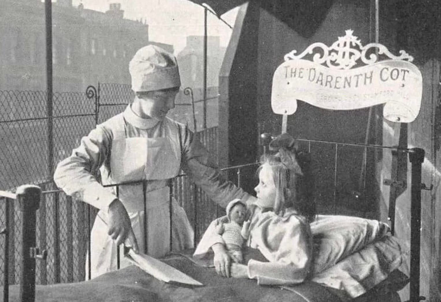 an image showing a nurse tending a child in the darenth cot